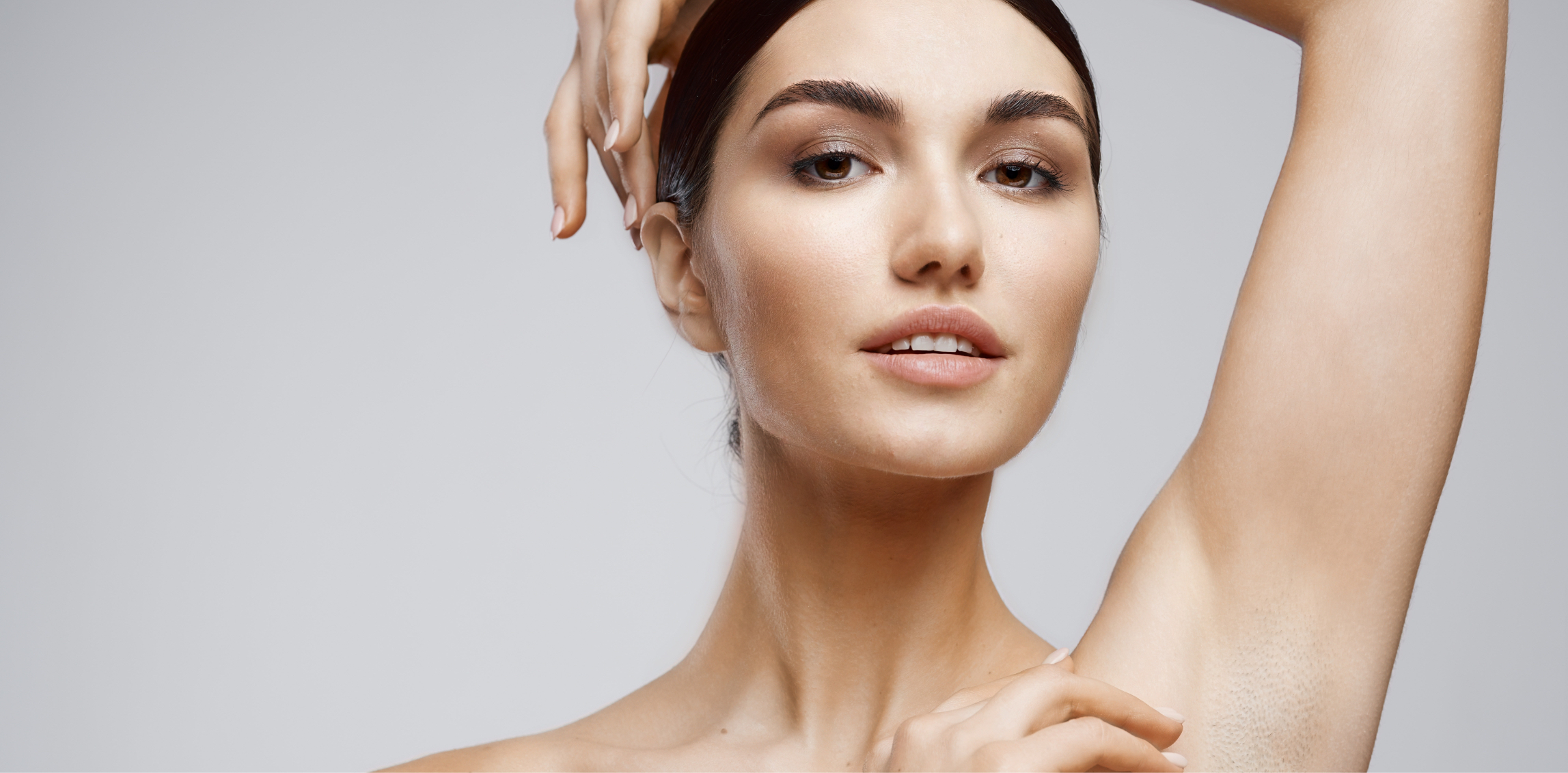 Woman showing her armpit after laser hair removal