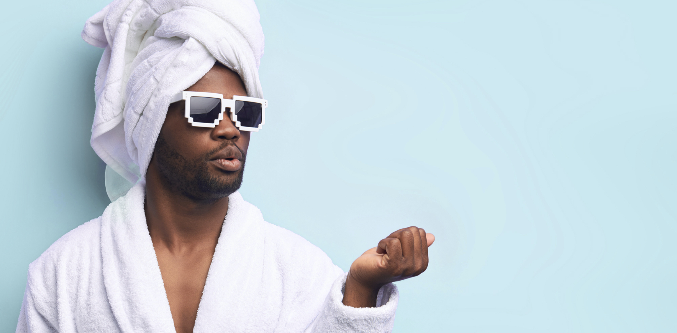 Man wearing sunglasses and a spa robe