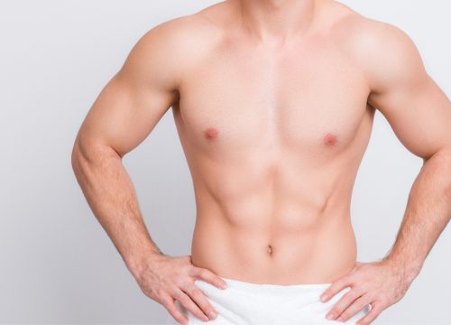 Man's hairless chest after waxing services